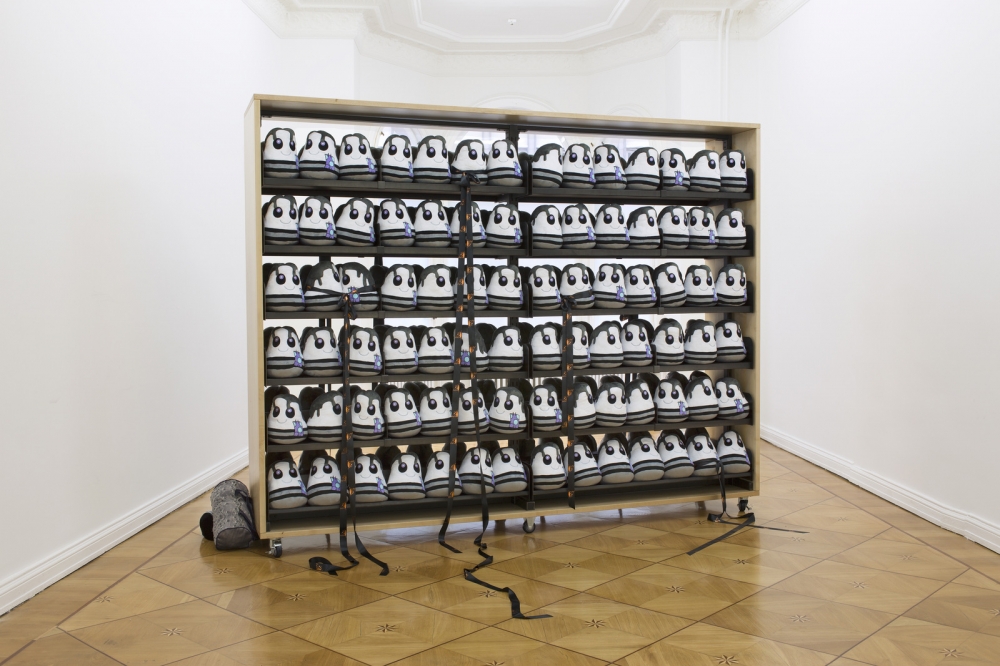 Bunny Rogers 'Clone State Bookcase', 2014 Maple wood, metal, Limited-Edition Elliott Smith plushdolls 'FerdinandtheBull' third-place mourning ribbons, casters 246 x 309 x 61 cm